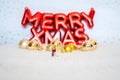 Miniature lover couple with background gold-yellow-gilter christmas ball, merry chistmas and happy new year concept
