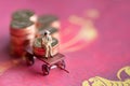 Man sitting on a coin has a rickshaw Financial concept. Red background