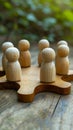 Miniature meeting wooden figures engaged in a discussion