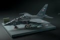 Miniature of military fighter without pilot cabin on a black background with place for text Royalty Free Stock Photo