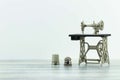 Miniature model of beautiful vintage sewing machine and two old