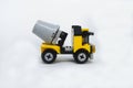 A miniature model of a Construction Mixer Lorry made of plastic bricks