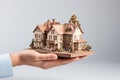 Miniature model of house in human hand, real estate concept. Royalty Free Stock Photo