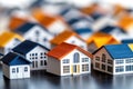 Miniature model houses with blue and orange roofs in suburban setting Royalty Free Stock Photo