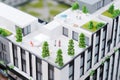 Miniature model, miniature toy buildings, cars and people. City maquette. New building project