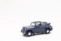 Miniature model of a vintage retro car toy on a white background Royalty Free Stock Photo