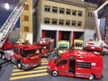 Miniature models of fire trucks and ladder trucks.