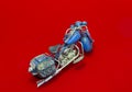 Miniature Motorcycle on Red Background Royalty Free Stock Photo