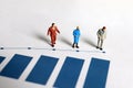 Miniature older people and blue bar graph. The concept of increasing life expectancy. Royalty Free Stock Photo