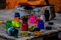 Miniature paint cans in the foreground, colored