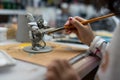 Miniature painting at a hobby desk Royalty Free Stock Photo