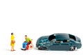 Miniature people : Accident scene, car crash on white background Royalty Free Stock Photo