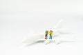 Miniature people adventure backpacker passenger standing on toy