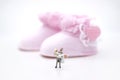 Miniature people : Bride and groom wear wedding suit and waiting for baby in the future . Image use for make new family