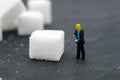 Miniature people buisnessmen sugar. Health care concept. Royalty Free Stock Photo