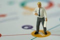 Miniature people business concept as businessman standing and pr Royalty Free Stock Photo