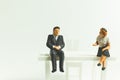 Miniature people business concept sitting on chair with a space Royalty Free Stock Photo