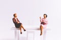 Miniature people business concept sitting on chair with a space Royalty Free Stock Photo