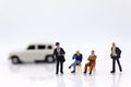 Miniature people: Business consultants on financial transactions for car loan . Image use for financial, business concept