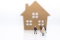 Miniature people: Business consultants on financial transactions for home loan . Image use for financial, business concept