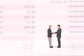 Miniature people on business datar and shaking hand Royalty Free Stock Photo