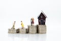 Miniature people : Business on financial transactions for home loan. Image use for invesment, business concept