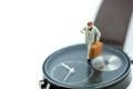 Miniature people : business man looking at watch and walk on the