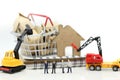 Miniature people : businessman Construction site with equipment. Royalty Free Stock Photo