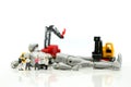 Miniature people : Businessman and Engineer deal production robots,industry Robot Business concept.