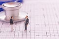 Miniature people : Businessman figures standing on the cardiovascular medical exam