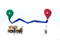 Miniature people : Businessman getting to the destination with a vehicle. Image use for travel concept