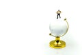 Miniature people : Businessman with glass globe. Royalty Free Stock Photo