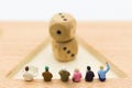 Miniature people : Businessman group consult business ideas, dice with risk. Image use for to solve problems, business concept. Royalty Free Stock Photo