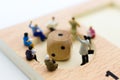 Miniature people : Businessman group consult business ideas, dice with risk. Image use for to solve problems, business concept Royalty Free Stock Photo