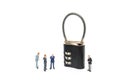 Miniature businessman helps to unlock password on the keys