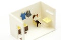 Miniature people : businessman reading newspaper sitting in bath Royalty Free Stock Photo