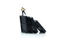 Miniature people : Businessman with Stack of dominoes falling ,business solution, strategy and successful intervention Royalty Free Stock Photo