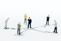 Miniature people: Businessman stand in various positions. Image use for business cycle, responsibility Royalty Free Stock Photo