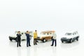 Miniature people : Businessman standing with car. Image use for Advertising product in the market today