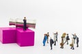 Miniature people: Businessman standing on wood block with binoculars. Image use for Choice of the best suited employee, HR, HRM,