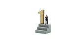 Miniature people : Businessman and team with wooden number of 1,2,3 , to be the first,business competition concept.