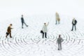 Miniature people : Businessmen are looking for a solution and teamwork. Image use for solve problems and new idea concept Royalty Free Stock Photo