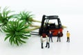 Miniature people : Businessmen make agreements on forestry. Image use for take advantage of the tree, business concept