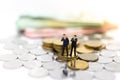 Miniature people : Businessmen with money, The rhythm of market share contention, image use for risk, money, business concept Royalty Free Stock Photo