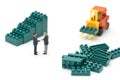 Miniature 2 people businessmen Shake hands with High-lifted forklift trucks are a great way to grow your business as a high-tech,