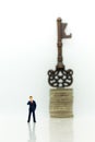 Miniature people: Businessmen stand with keys. Image use for key man, the key to success, business concept Royalty Free Stock Photo