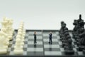 Miniature 2 people businessmen standing on a chessboard with a c Royalty Free Stock Photo