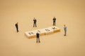 Miniature people businessmen standing with wood word RISK using as background business concept and Risk concept with copy space