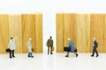 Miniature people : Businessmen are walking to the exit point. Image use for the best choice of choose, business concept Royalty Free Stock Photo