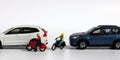 A motorcycle rider who forcefully intervenes between two cars. Concept on the importance of safe driving and the risk of accidents Royalty Free Stock Photo